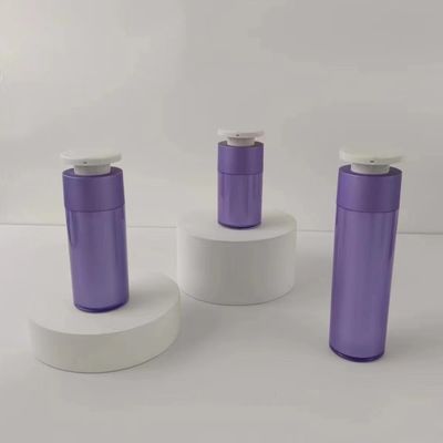 Bouteille pour distributeur cosmétique en plastique violet avec pompe à pression blanche