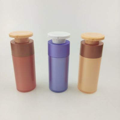 Bouteille pour distributeur cosmétique en plastique violet avec pompe à pression blanche