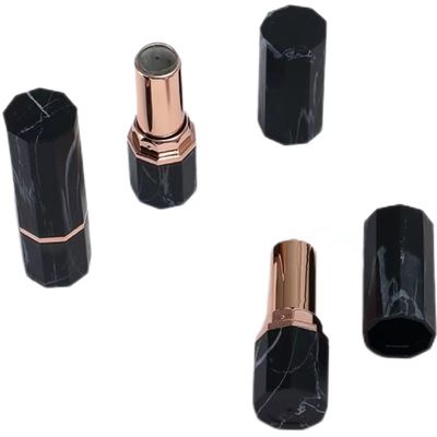 Container de tube octagonal en marbre noir de luxe avec accent or rose