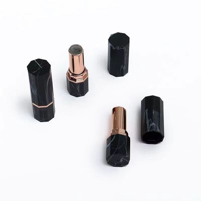 Container de tube octagonal en marbre noir de luxe avec accent or rose