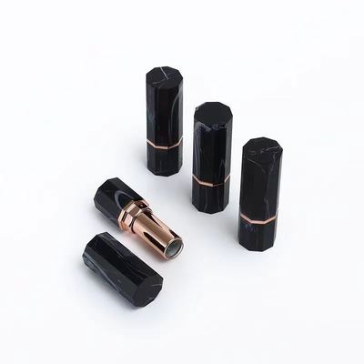 Container de tube octagonal en marbre noir de luxe avec accent or rose