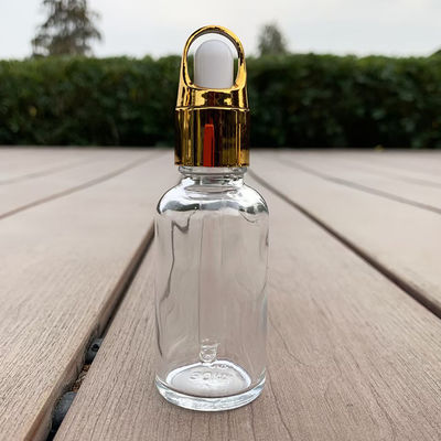 Flacon compte-gouttes en verre transparent avec bouchon doré